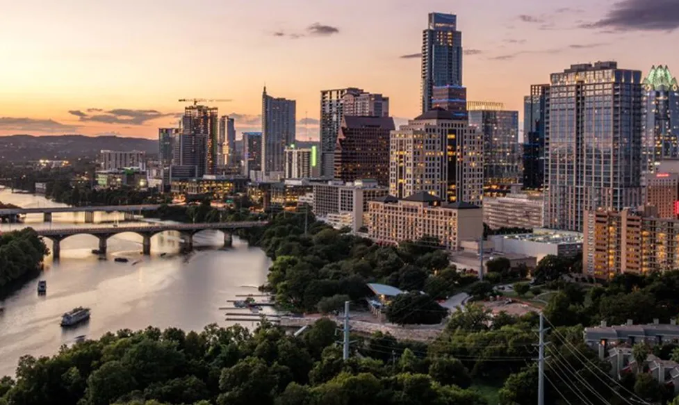 A shot of central Austin, Texas with the river and central business district at dusk