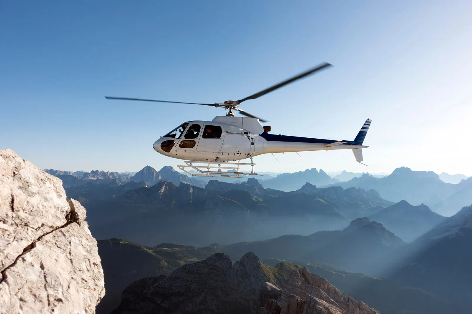 Chartered helicopter flying around the Matterhorn on a luxury Swiss Alps holiday package