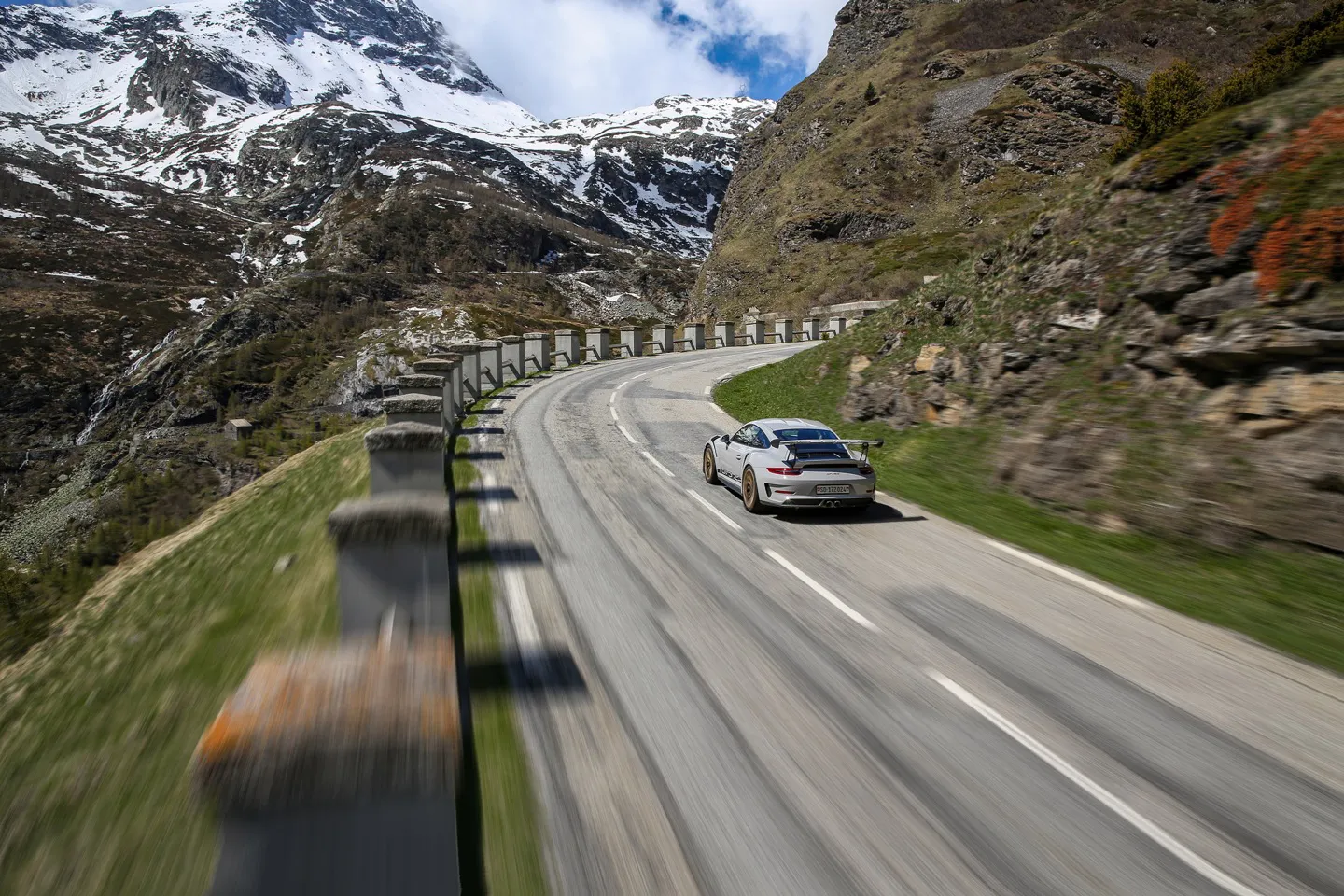 Porsche driving up Susten Pass in Switzerland on a Swiss Alps tour package with supercars