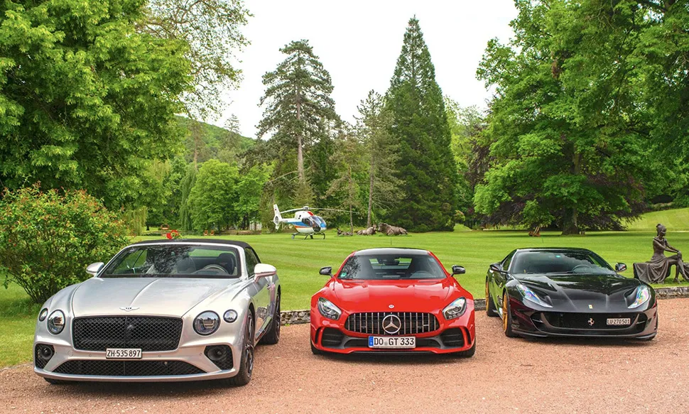 Bentley Mercedes and Ferrari parked and ready for a road trip