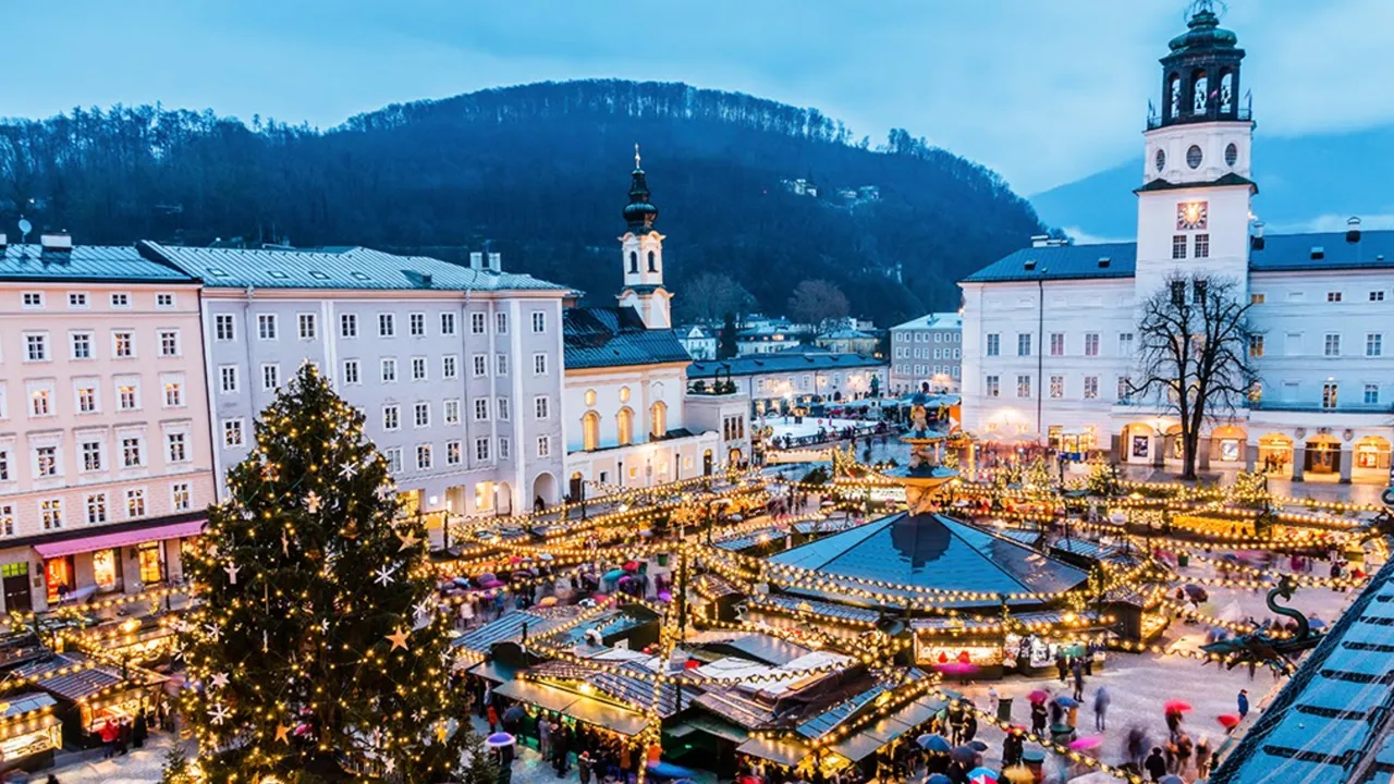 Overlooking the Salzburg market, christmas tree, carousel and onto the mountains beyond