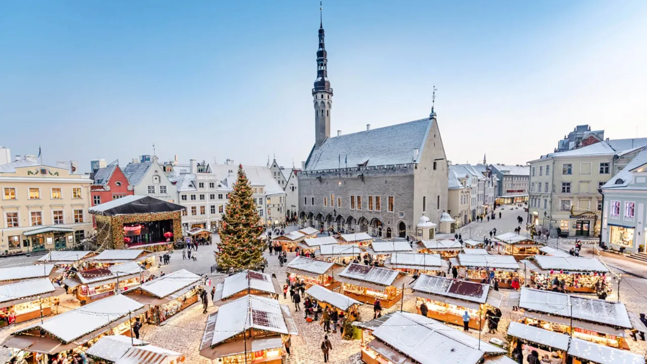 Small, snow-dusted wooden vendor stations at the Tallinn market in Estonia