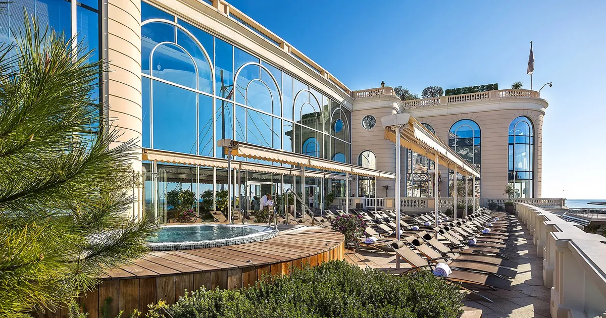 A sweeping terrace with spa pool and rows of sun loungers at the Thermes Marins, Monte Carlo.