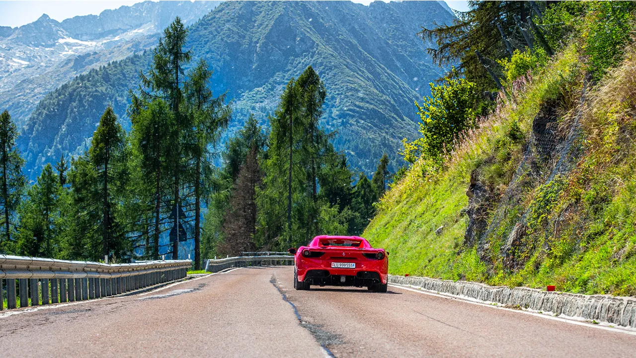 Supercars navigating Alpine passes in Switzerland