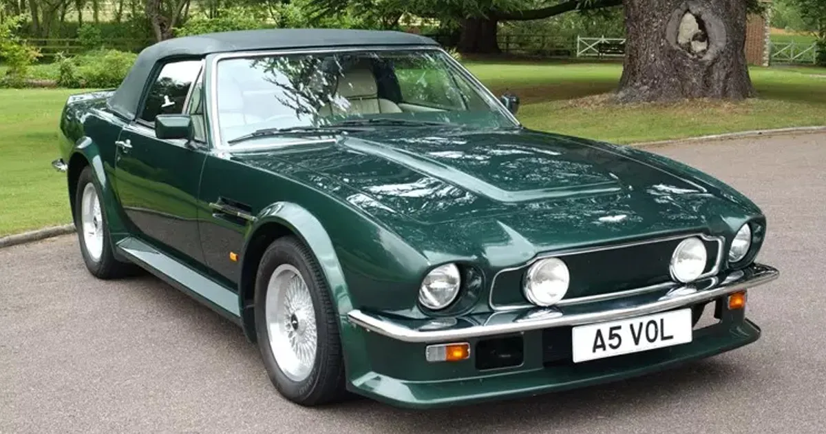 An immaculate example of a green Aston Martin V8 Vantage roadster from the 1970s.