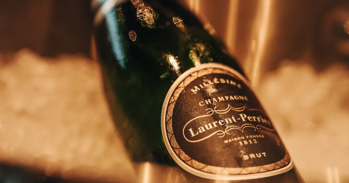 A close up of a bottle of Laurent-Perrier Champagne. 