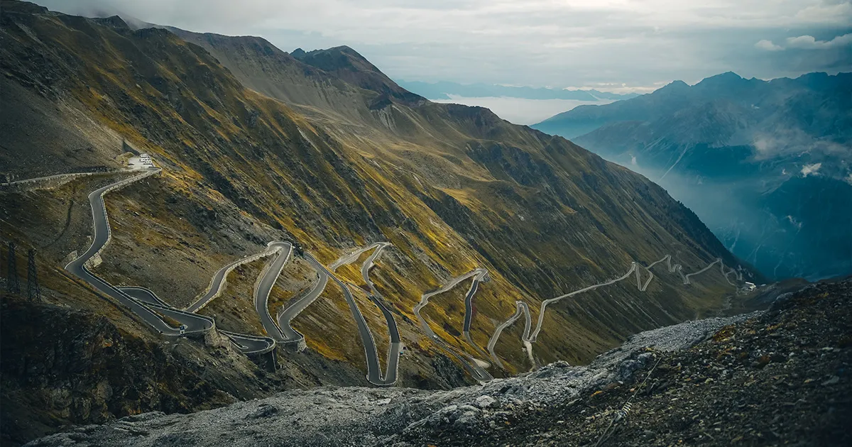 A steep alpine pass in Switzerland with many hairpin bends.