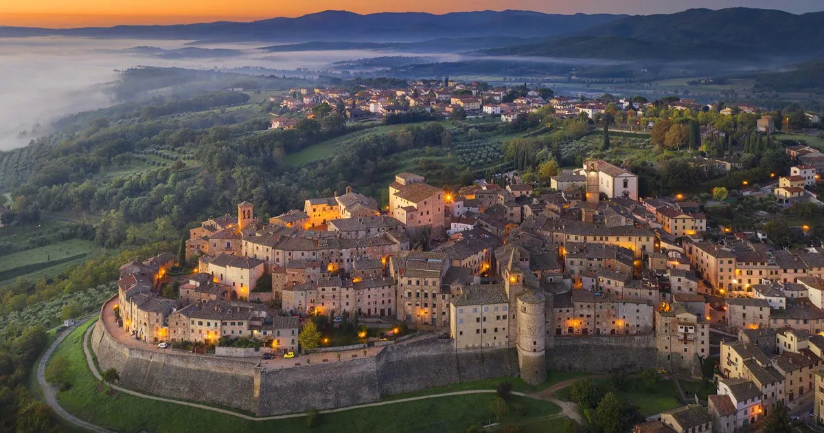 Anghiari, Tuscany seen from above as it is illuminated in the evening sky.