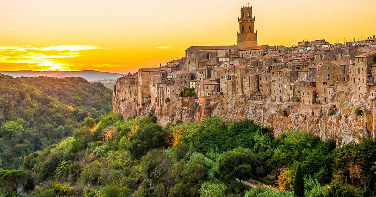 Cliff-top buildings in Pitigliano, Tuscany seen on a golden evening.