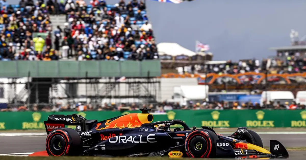 Max Verstappen’s blue Red Bull Racing F1 car at Silverstone with the crowd in the background