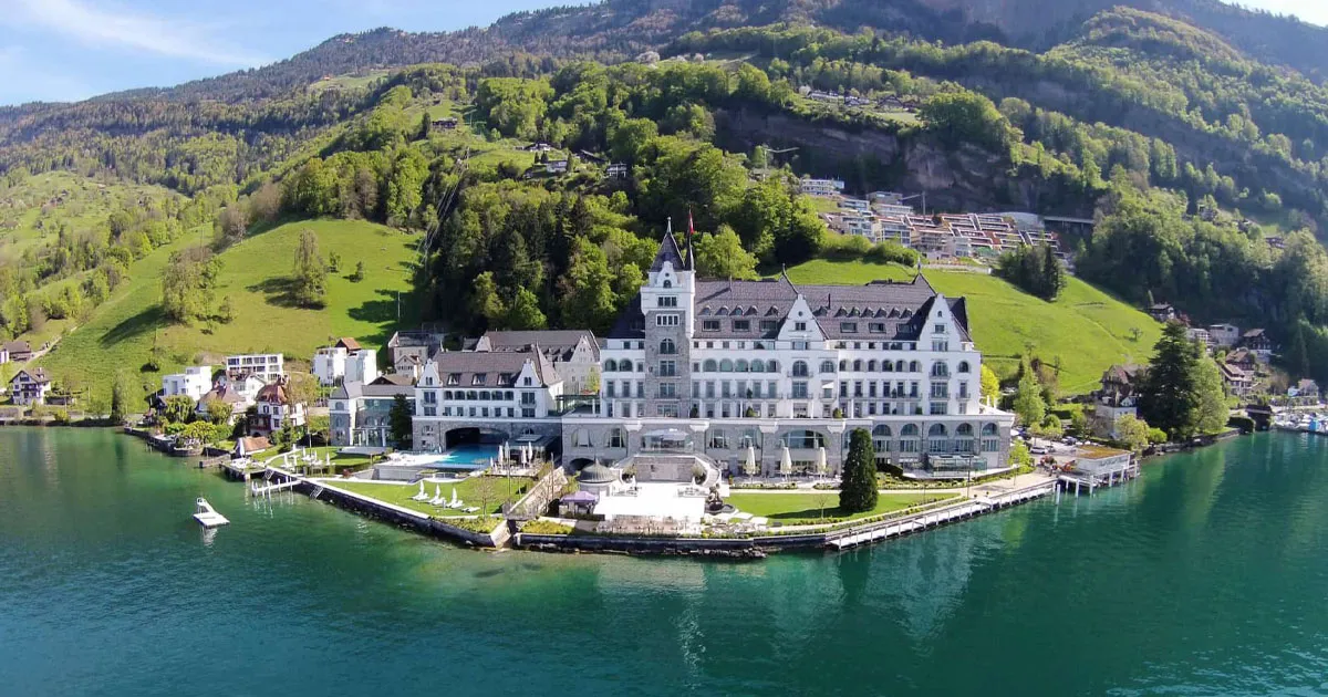 The white stone castle exterior of Park Hotel Vitznau at Lucerne