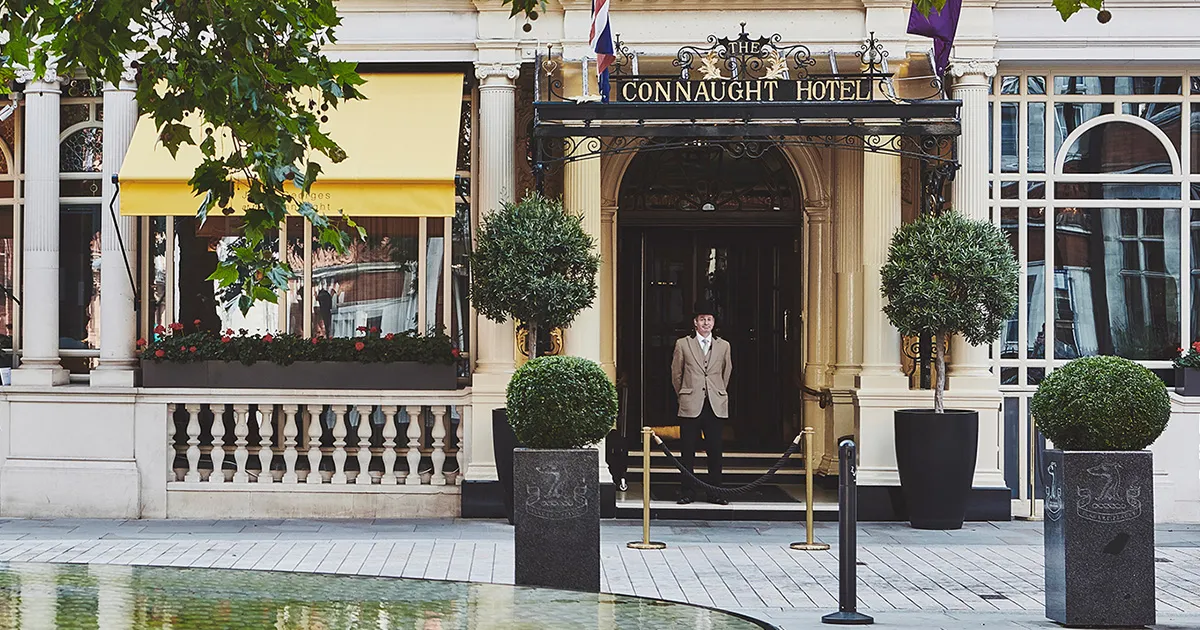 A porter awaits guests at The Connaught, London, England