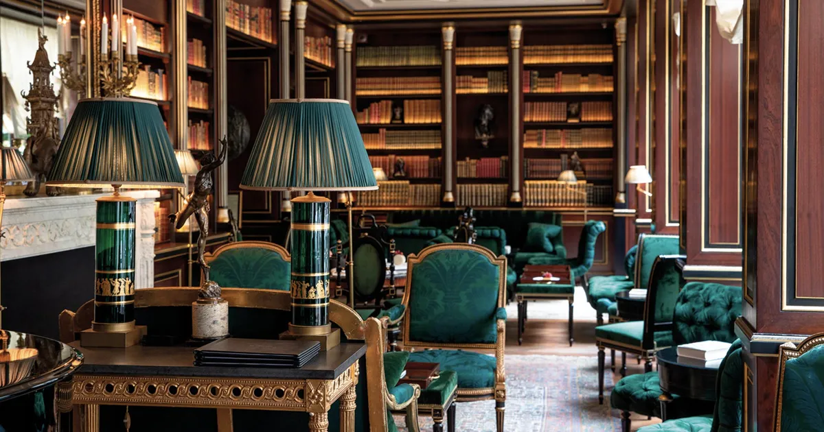 A grand room trimmed in green and gold at La Réserve Paris, France