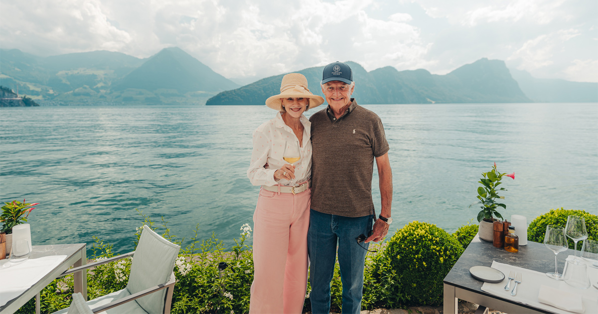 A happy couple on the shores of a beautiful lake in Europe