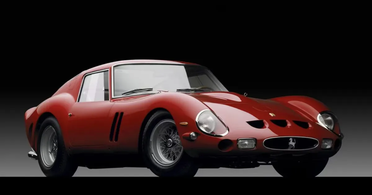 A red Ferrari 250 GTO sitting in a studio backdrop.