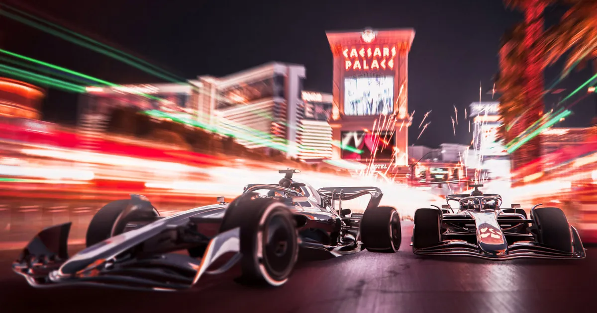 A 3D illustration of two F1 racing cars doing battle at night on the neon-lit streets of Las Vegas.