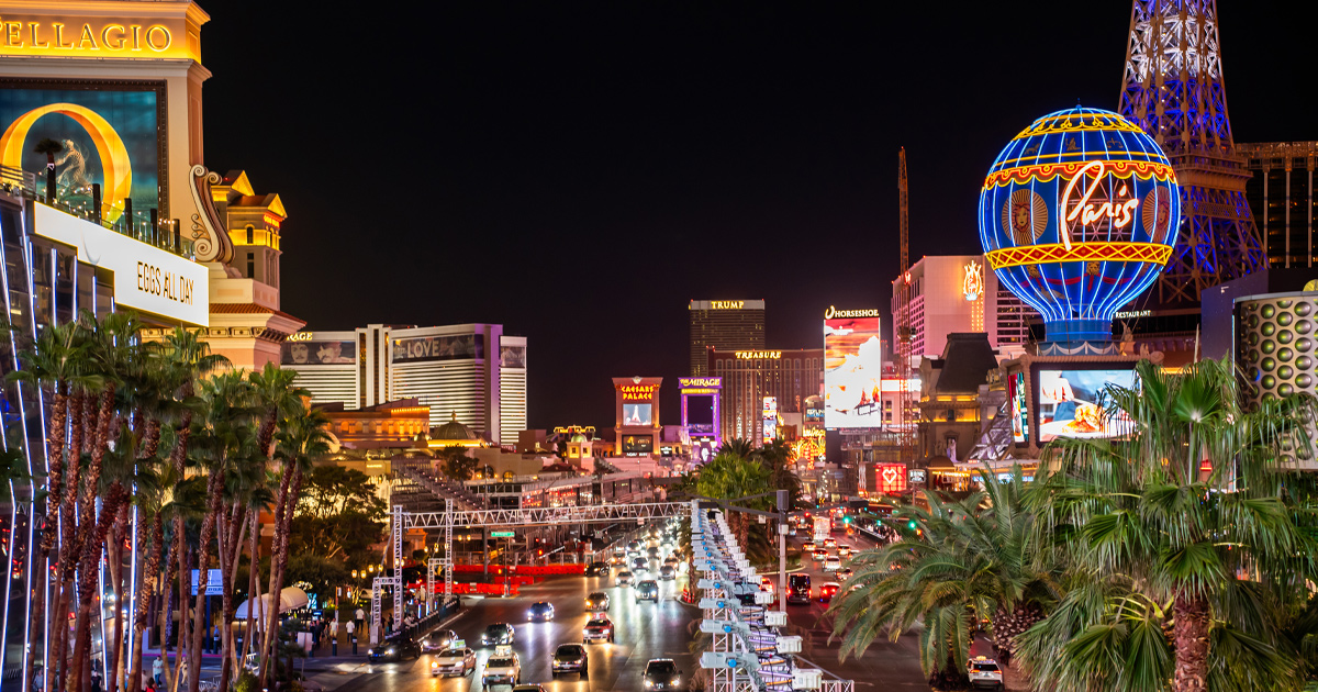 Las Vegas’ iconic strip by night, with casinos and hotels illuminated by bright neon lights