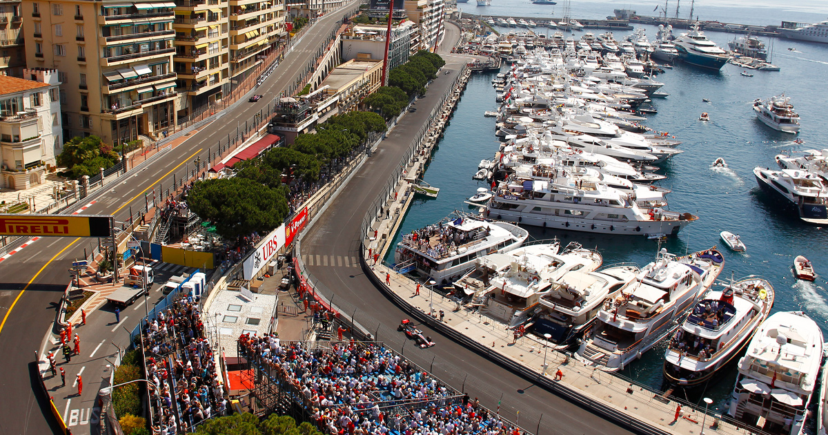 Superyachts in Port Hercule as F1 cars race around Monaco street circuit