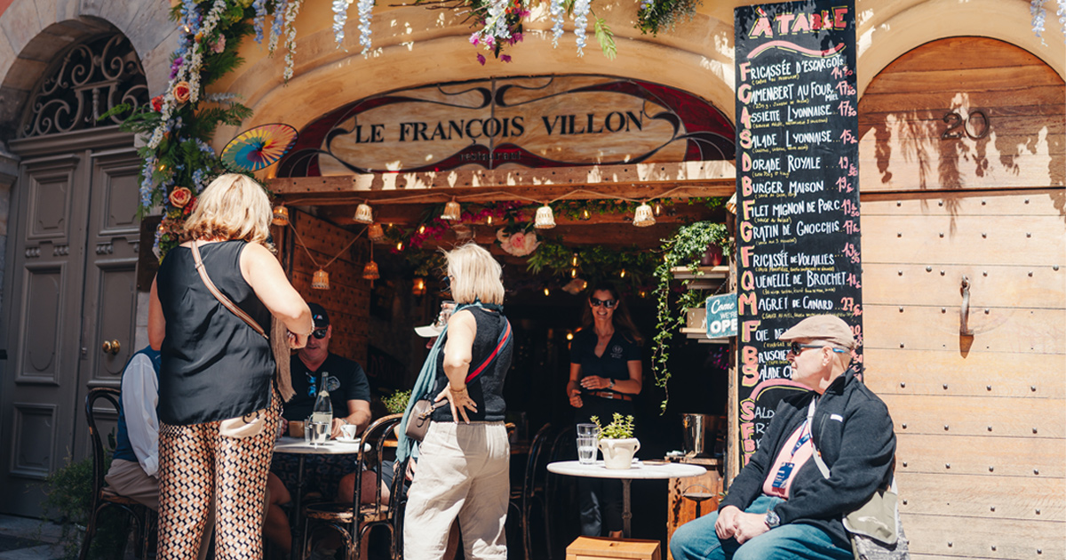 Ultimate Driving Tours guests enjoy a lunch at a traditional Lyon bouchon