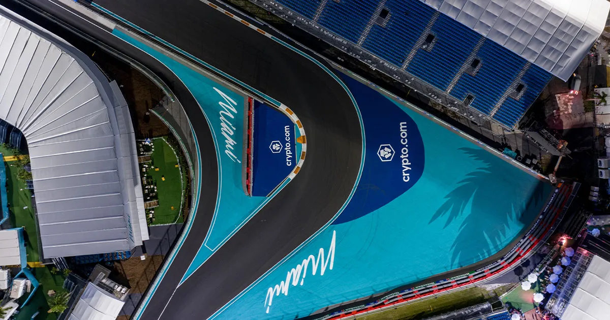 Top down view of a tight corner at the Miami F1 track with bright blue runoff areas