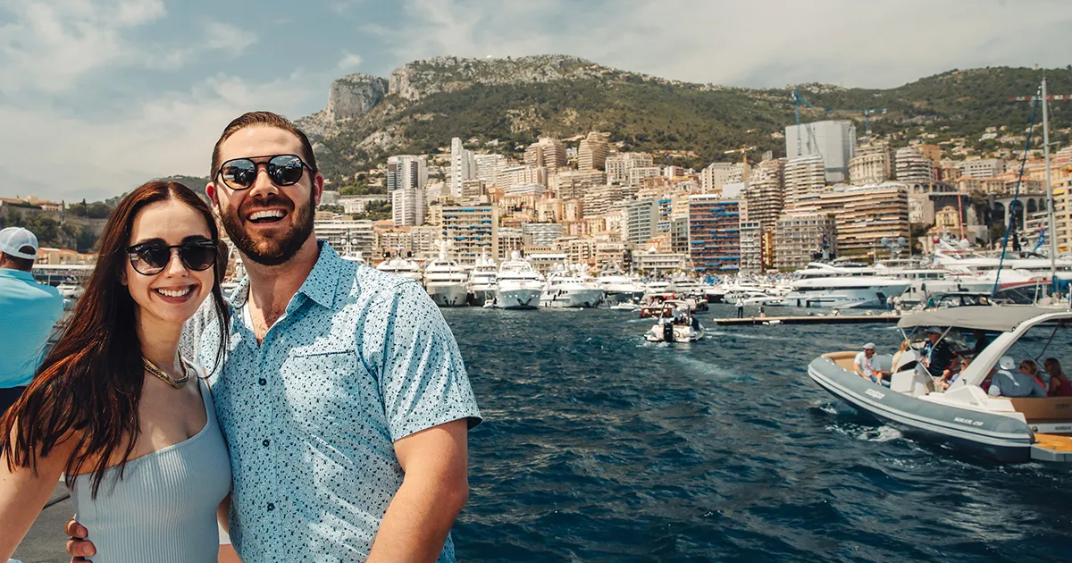 Couple enjoying Monaco Grand Prix aboard a yacht