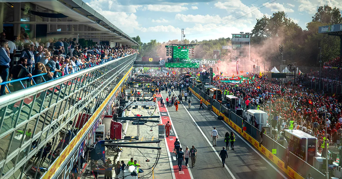 A sea of people on a race track celebrating a win for the Ferrari F1 team at Monza.
