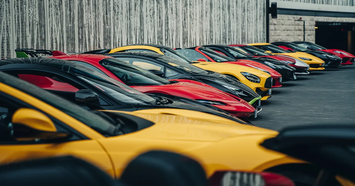 The Ultimate Driving Tours fleet of supercars neatly parked side by side.