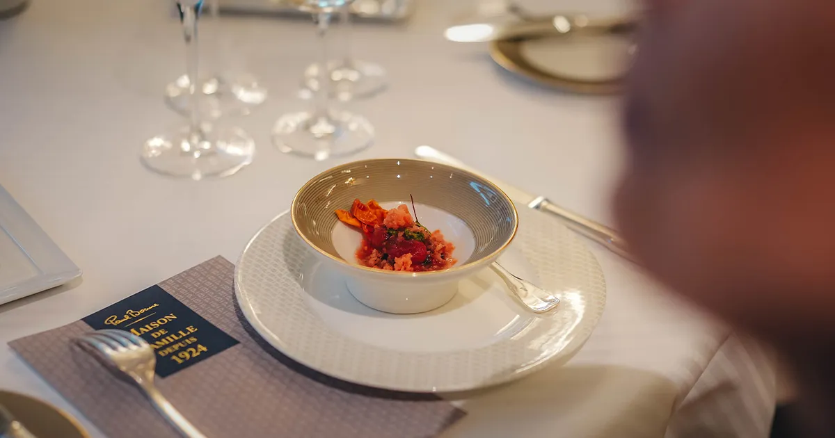 An exquisite starter in an ornate bowl at Restaurant Paul Bocuse