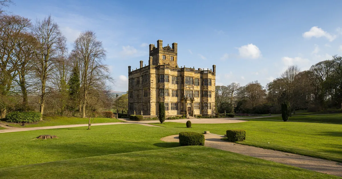 Immaculately presented lawns surround a stately home in the UK.