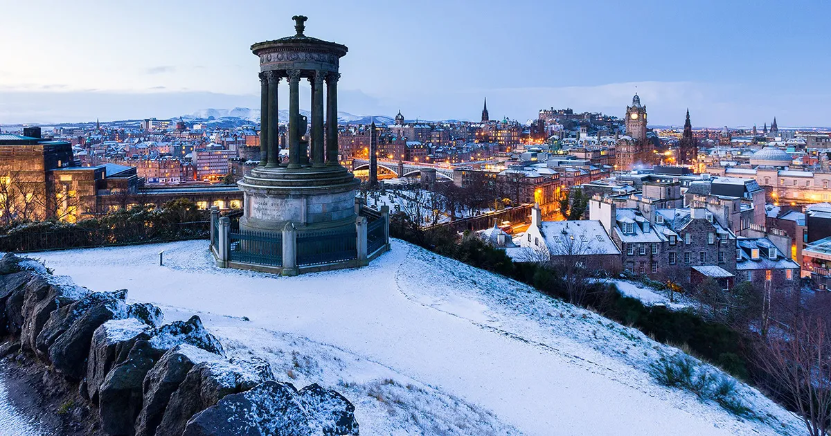 A view over Edinburgh from its famous castle on a winter’s evening.