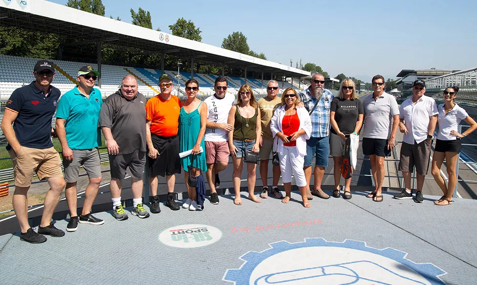 A group of guests on an Ultimate Driving Tours Italian supercar tour enjoying a tour of the legendary Monza racetrack