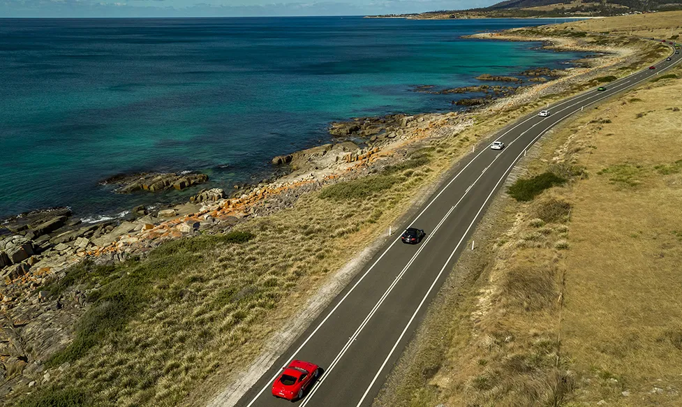 Supercars traverse the stunning coastal roads in Tasmania