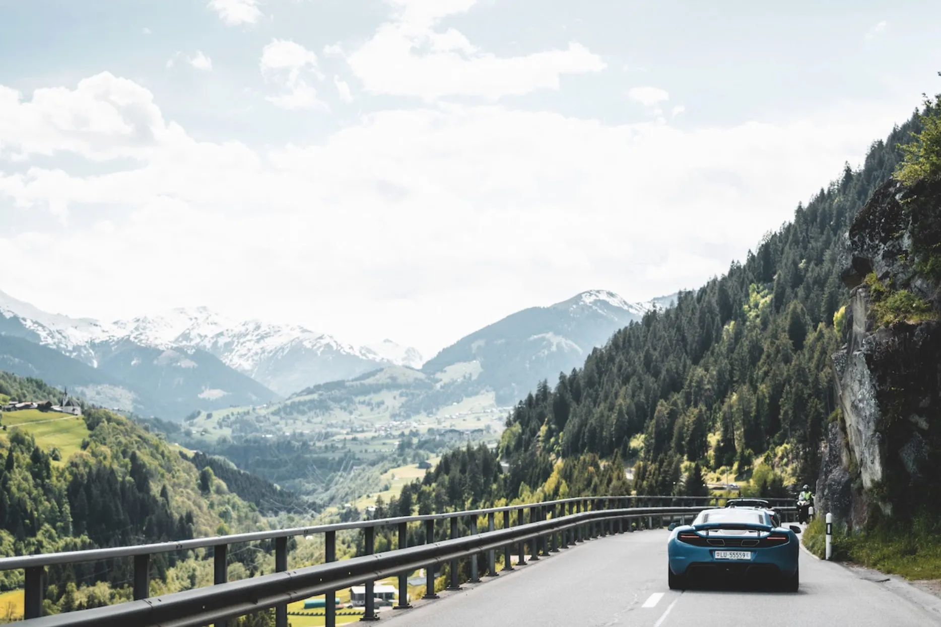 A Mclaren navigates a mountain road in Austria