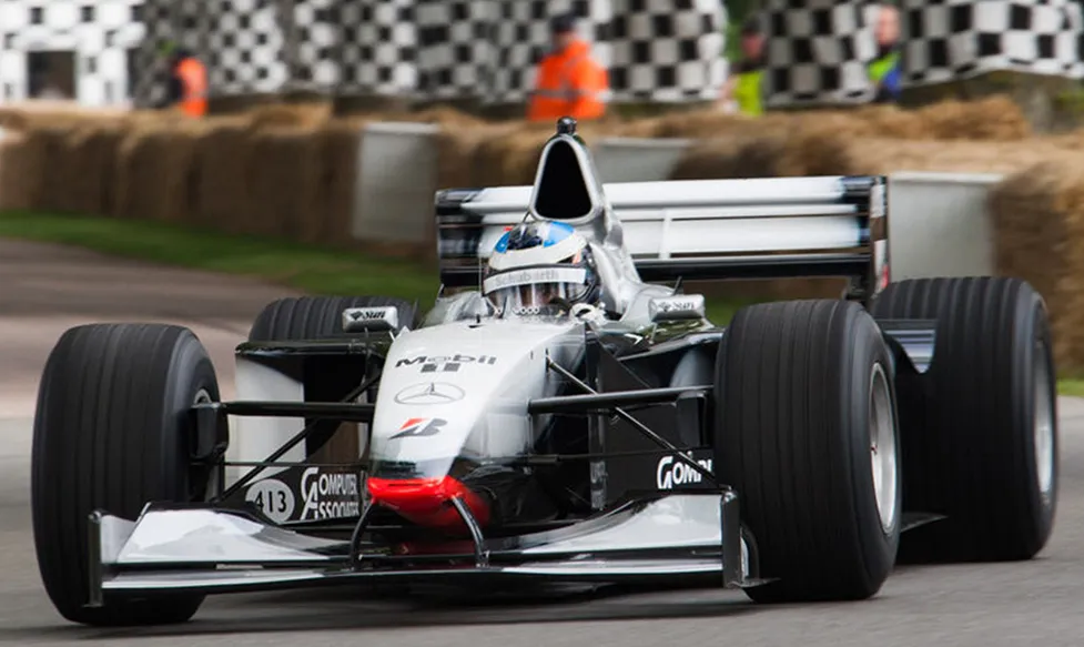 A McLaren-Mercedes former-F1 racing car makes the hillclimb at Goodwood Festival of Speed