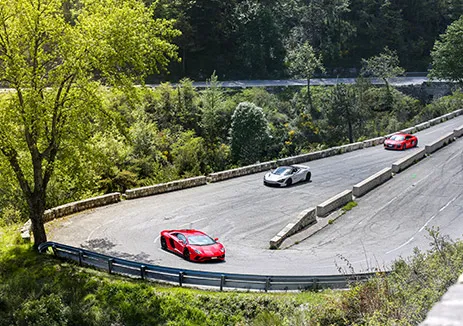 Porsche and Audi driving French countryside on a luxury driving holiday