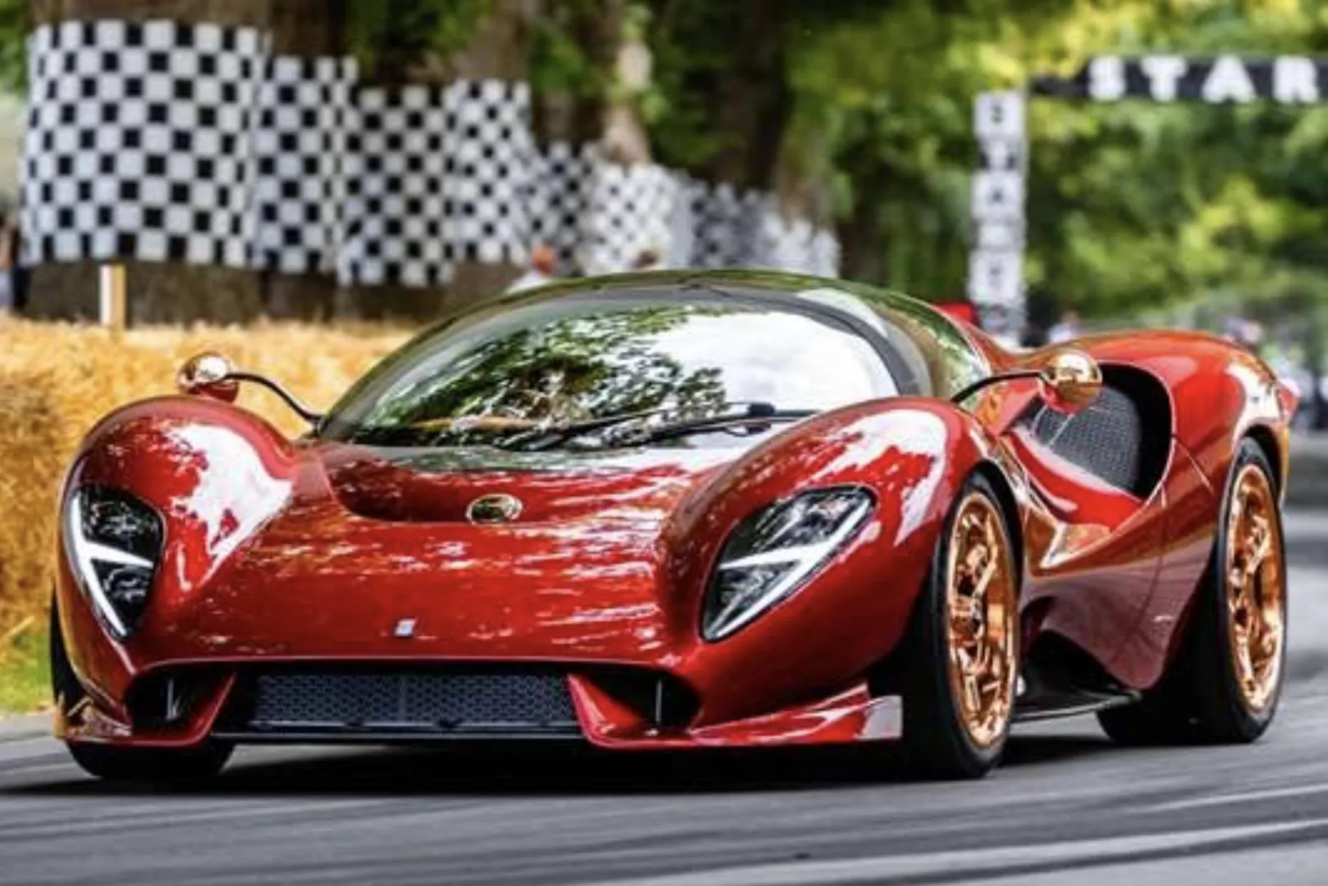 A car speeding away from the start line at Goodwood Festival of Speed