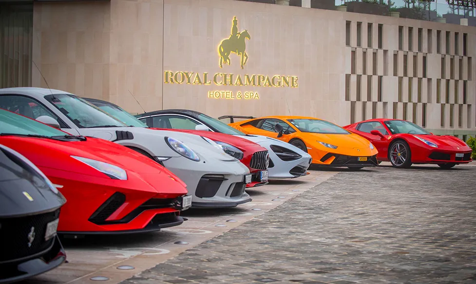 The Ultimate Driving Tours fleet of supercars parked outside the Royal Champagne Hotel and Spa in France