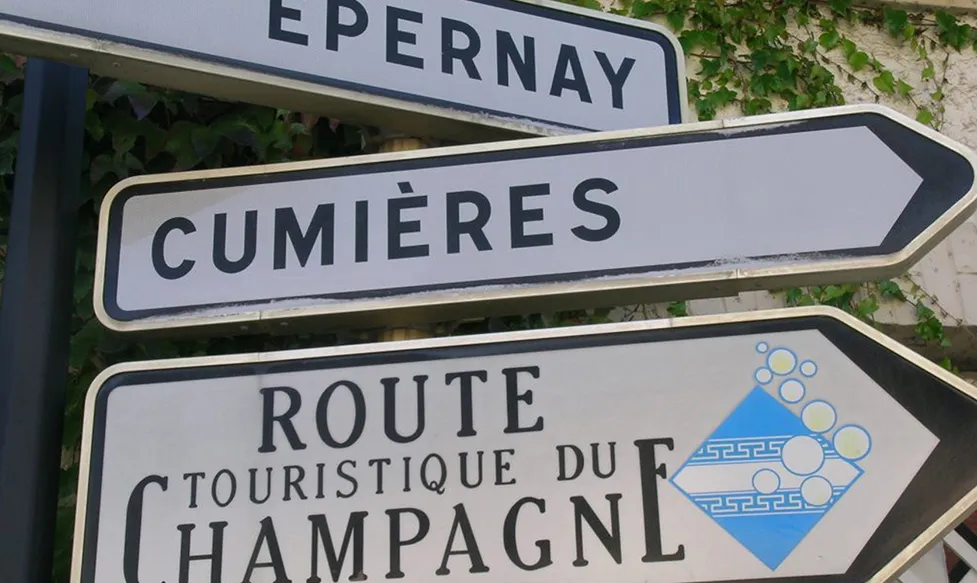 Road signs in Champagne, France displaying directions to Épernay and Cumières