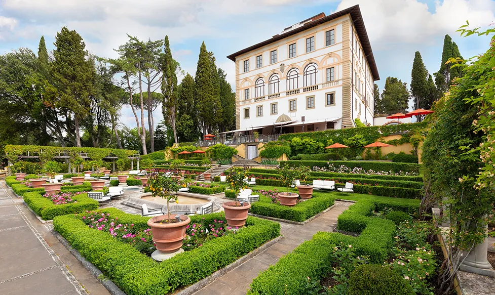 A view of luxury five-star villa Il Salviatino, Tuscany as seen from the flowerbeds in the garden