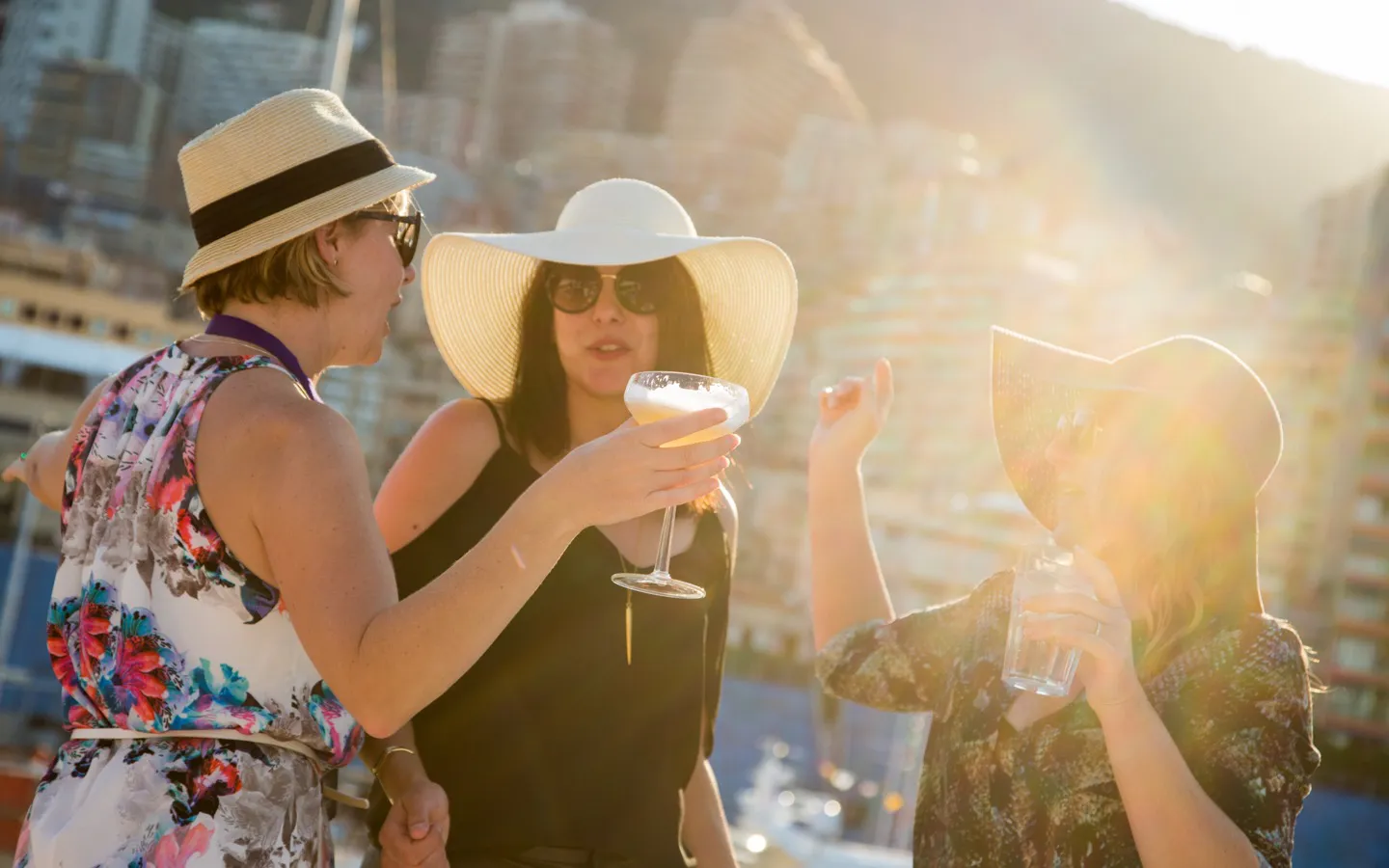 Guests drinking cocktails from all-inclusive premium bar on a yacht during the Monaco F1 Grand Prix