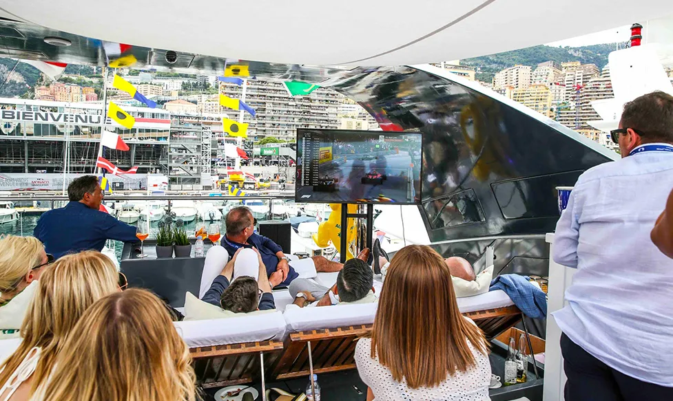 Guests relaxing aboard Ultimate Driving Tours' private superyacht at the Monaco Grand Prix