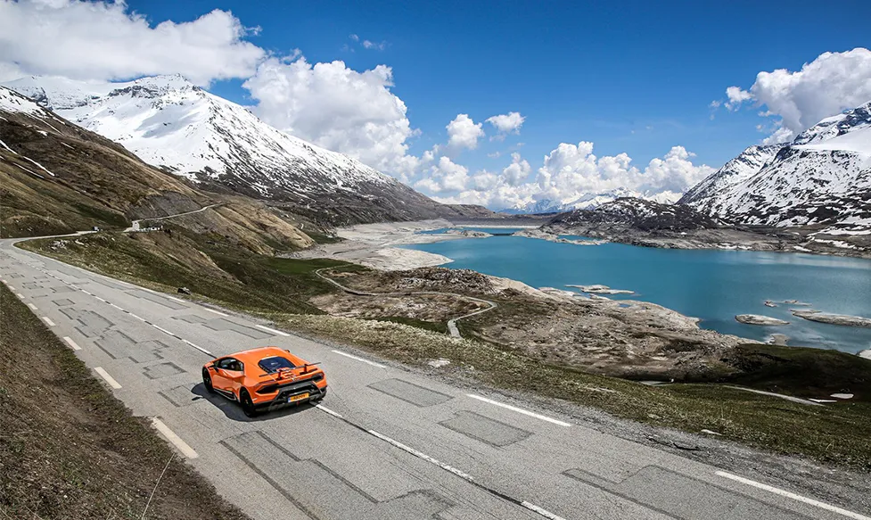 A Lamborghini Huracan carving up an alpine road on the European Supercar Tour
