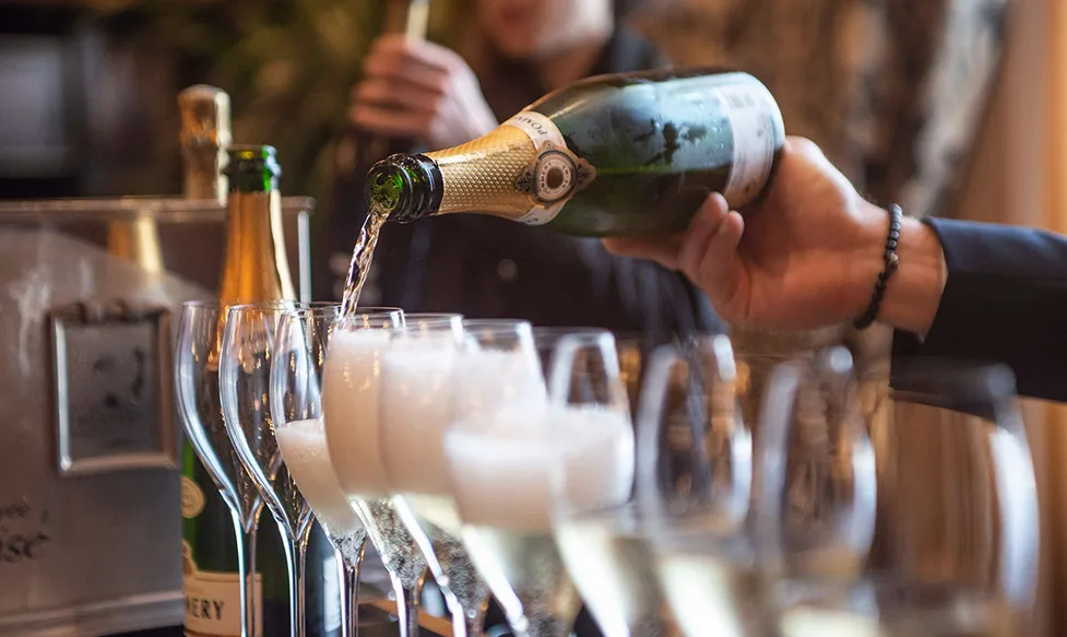 Champagne being poured into flutes