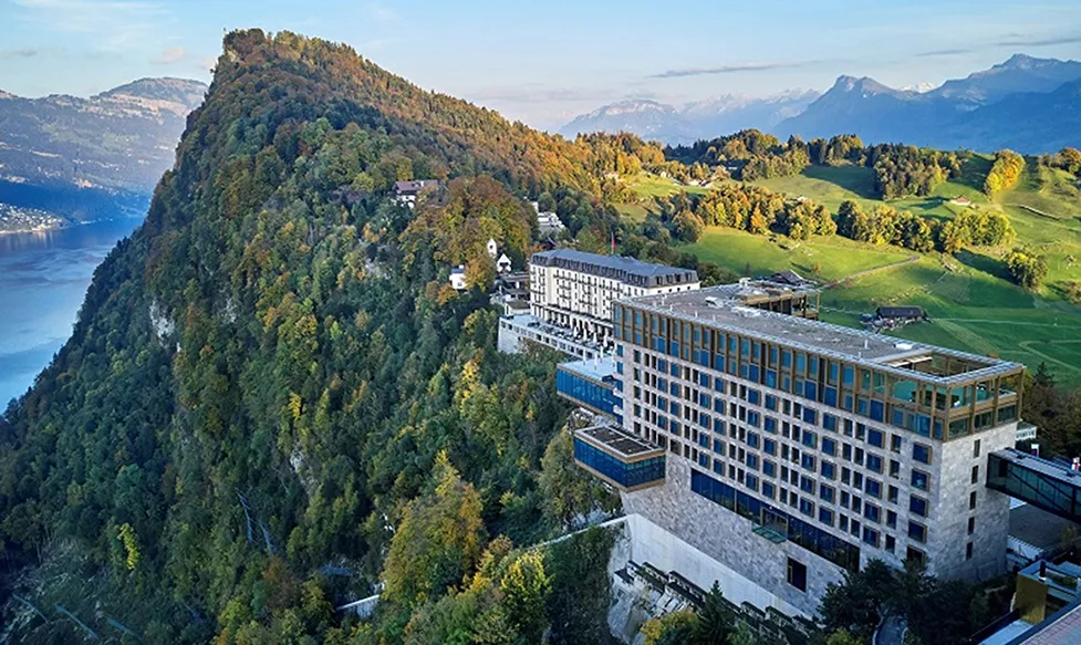 The sun sets over the Bürgenstock Resort in Switzerland