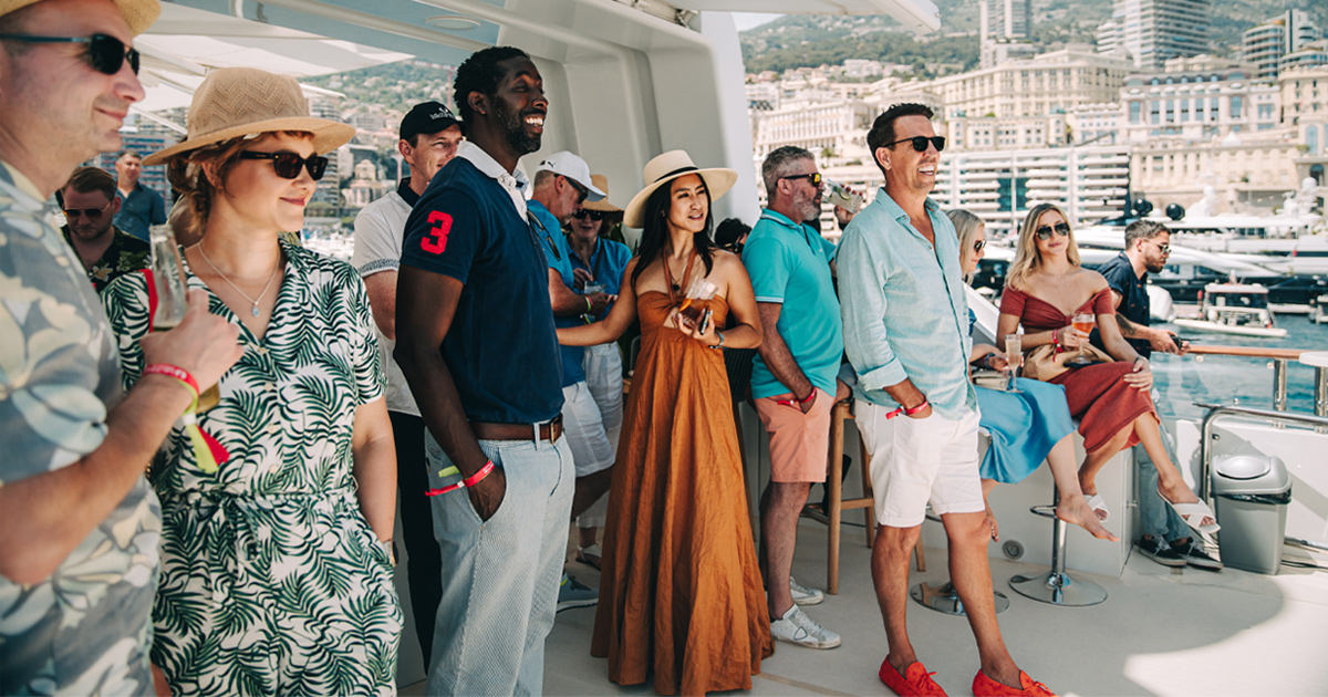 Luxury tour guests enjoying the Monaco Grand Prix aboard a privately chartered superyacht