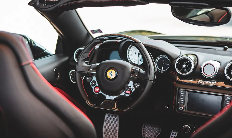 The interior of a late model Ferrari convertible, seen from the rear