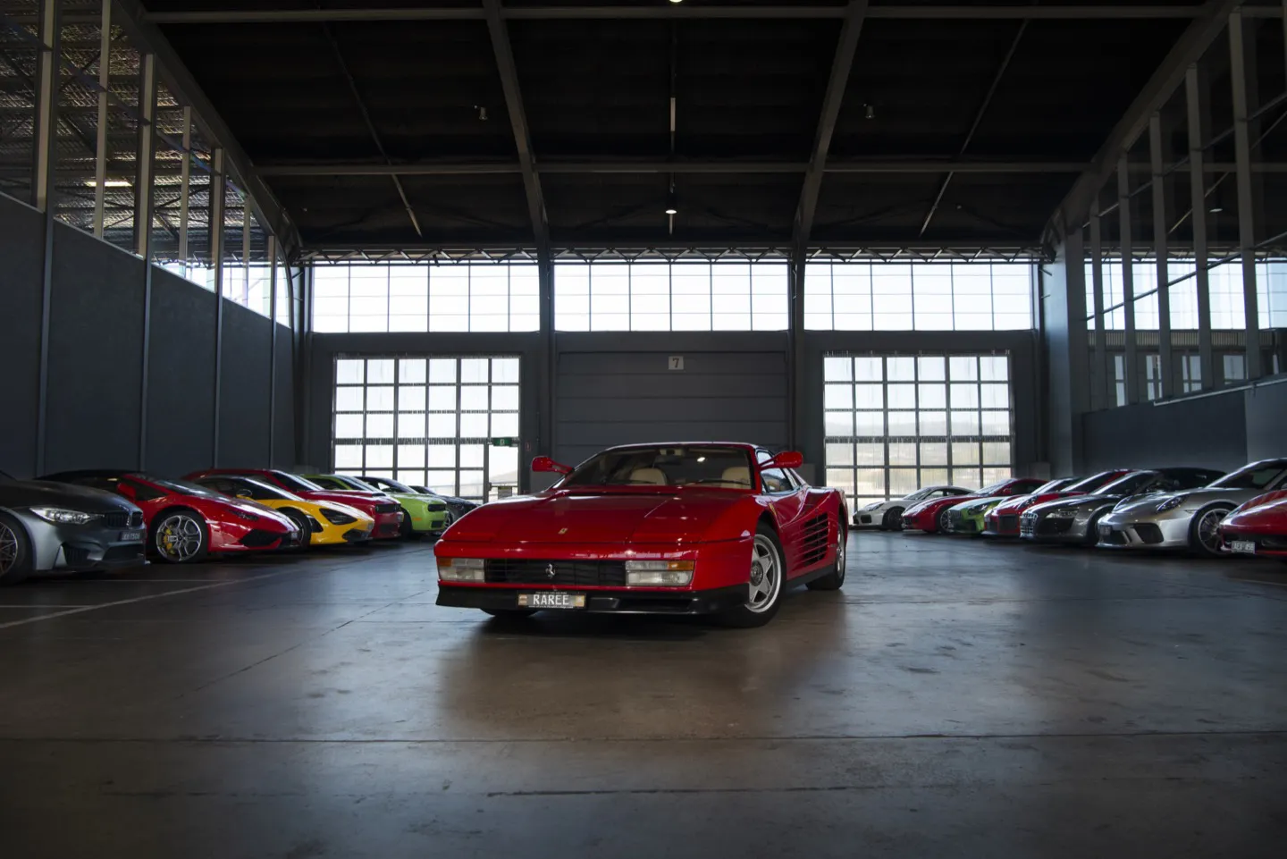 Ferraris and other supercars parked at MacQ01 in Hobart on our Targa Tasmania tour