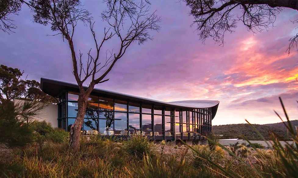 The sun sets over the beautiful luxury resort at Saffire Freycinet in Australia