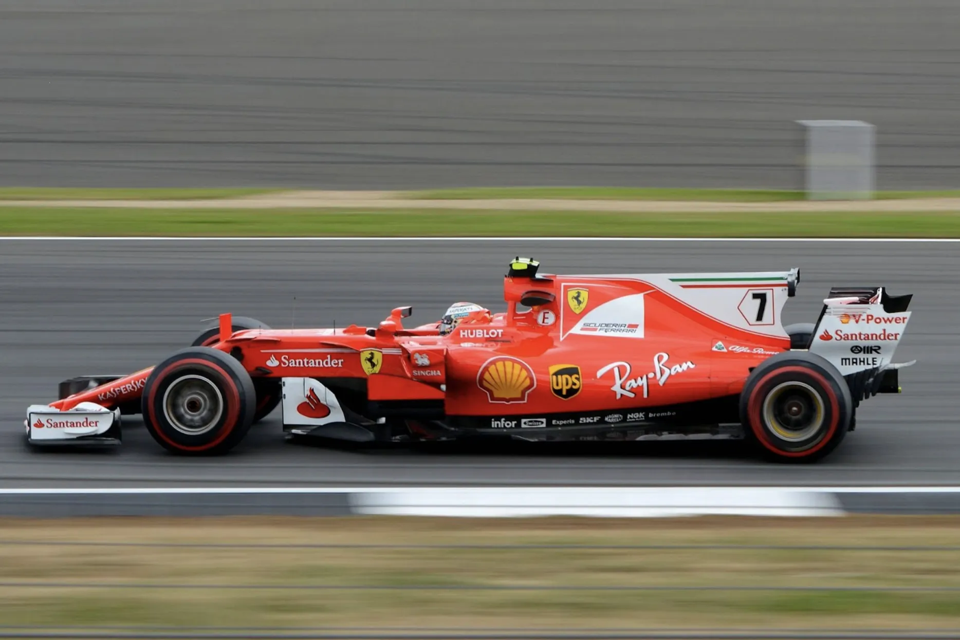 Kimi Raikonnen speeding down a straight in his Ferrari F1 car